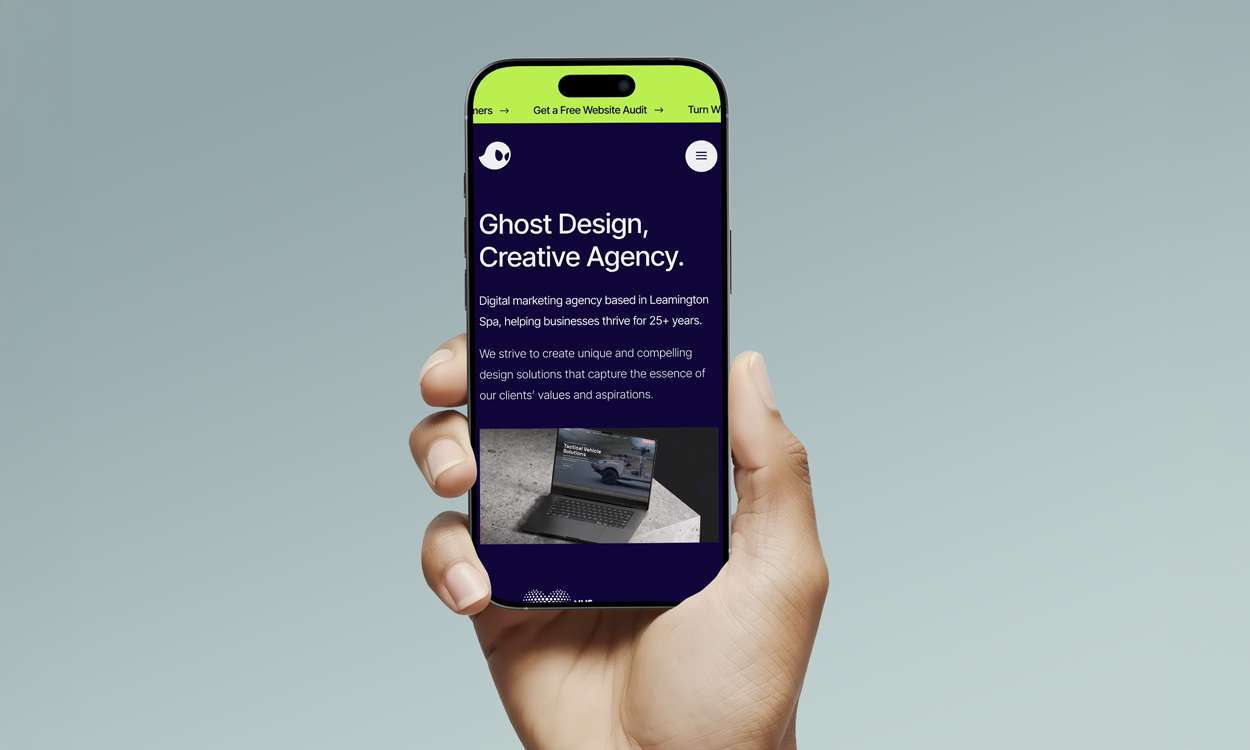 Ghost Design website mockup on a phone