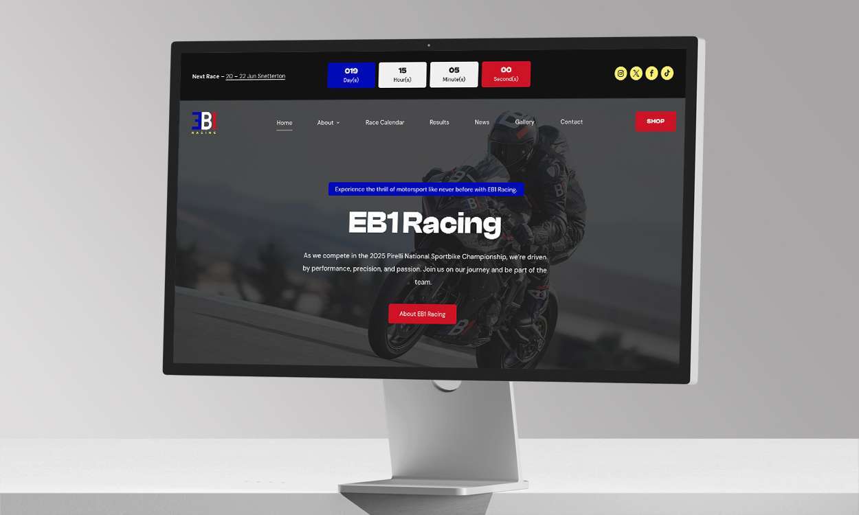EB1 Racing website mockup on a desktop computer